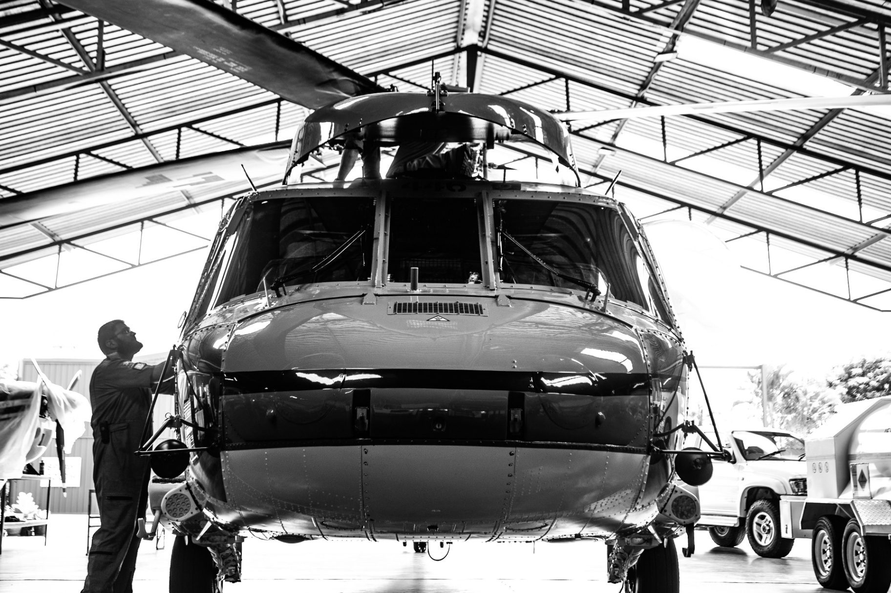 Leading Edge Aviation — Black Hawk in Hangar (B&W)
