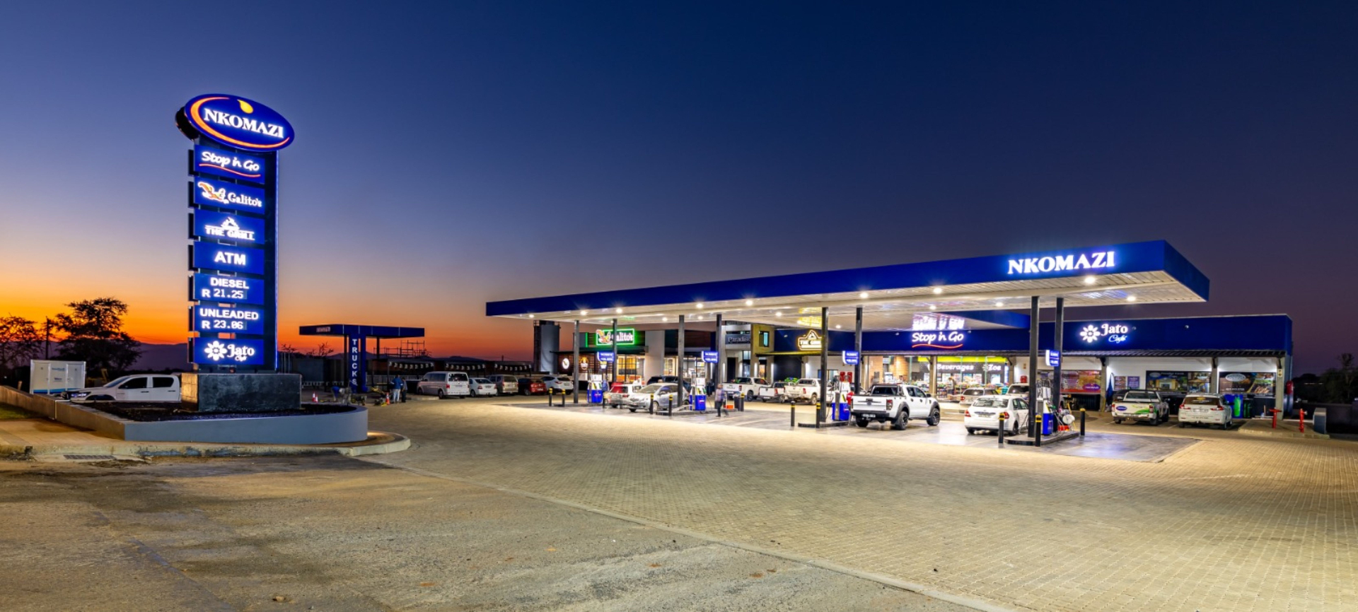 Nkomazi — Pylon & Forecourt at Dusk