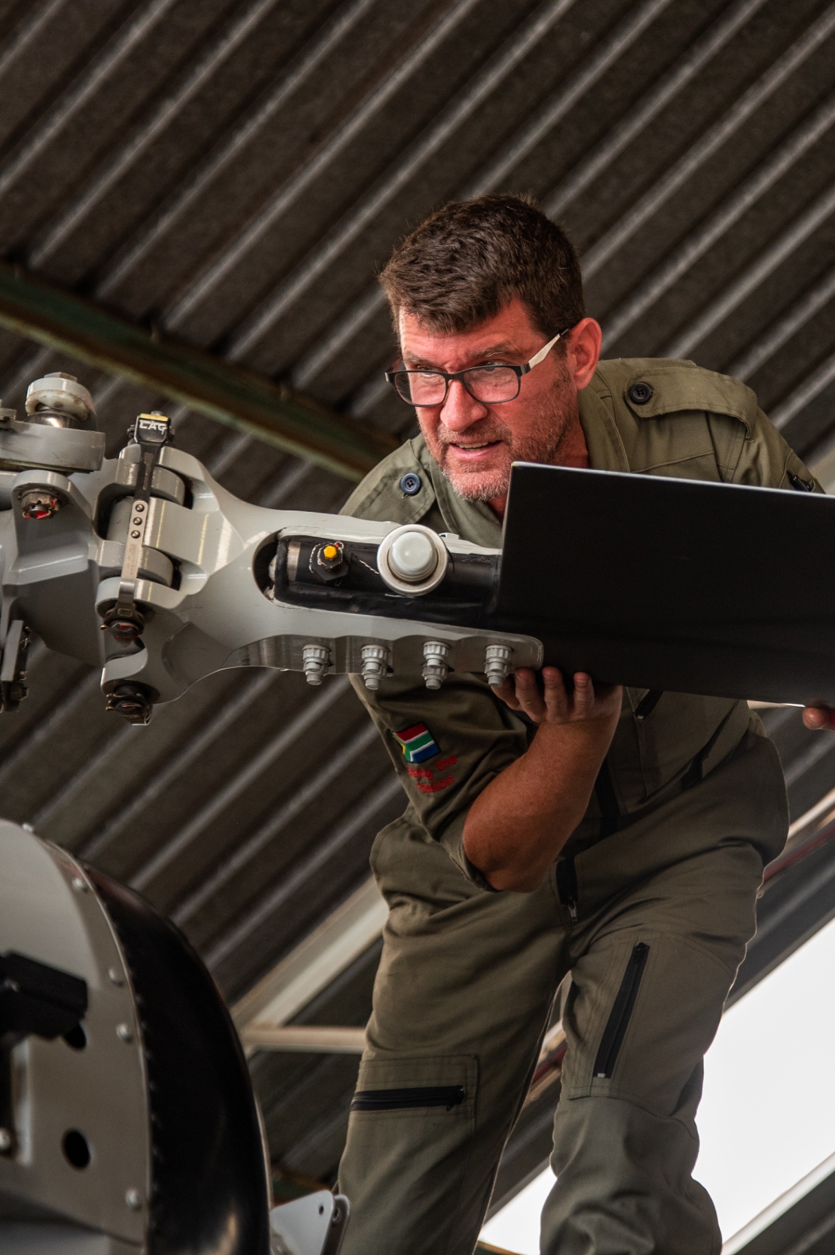Leading Edge Aviation — Technician Inspecting Rotor Head